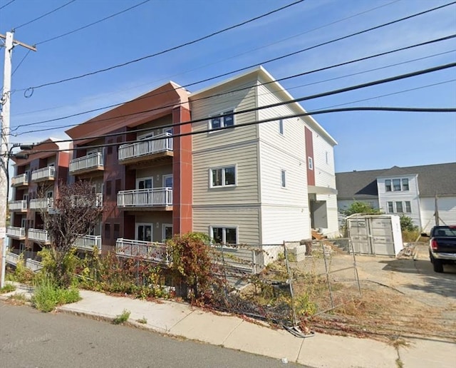 view of property exterior with fence