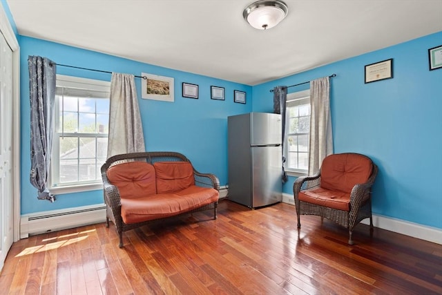 66 Adams St, Revere, MA 02151 - living area featuring a baseboard radiator, hardwood / wood-style floors, and baseboard heating