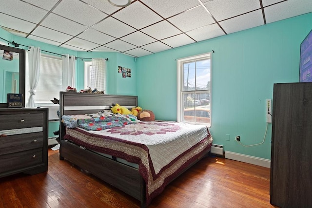 66 Adams St, Revere, MA 02151 - bedroom featuring a baseboard heating unit, hardwood / wood-style floors, and a paneled ceiling