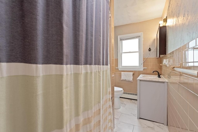66 Adams St, Revere, MA 02151 - full bath with baseboard heating, vanity, marble look tiles, and tile walls