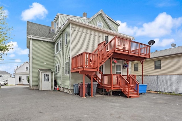 66 Adams St, Revere, MA 02151 - rear view of property featuring stairs, a deck, and a chimney