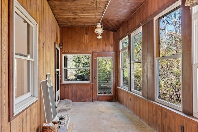 unfurnished sunroom with wooden ceiling