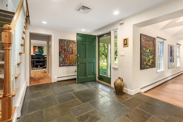 entryway featuring stairs, stone tile flooring, a baseboard radiator, and visible vents