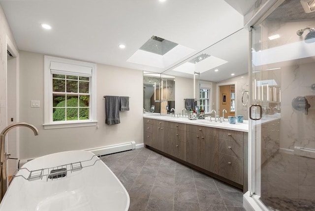 bathroom with recessed lighting, a sink, baseboard heating, a marble finish shower, and double vanity