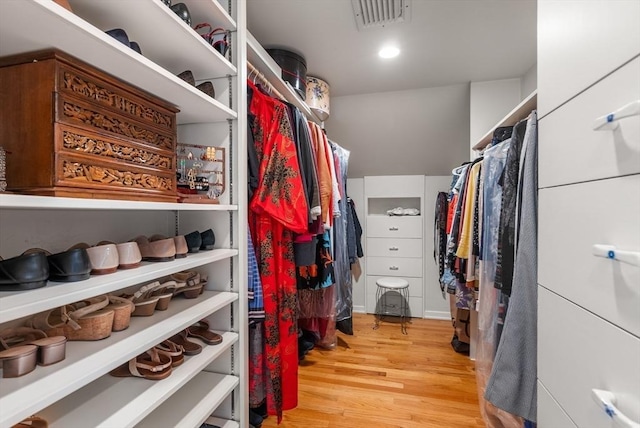 walk in closet with visible vents and light wood finished floors