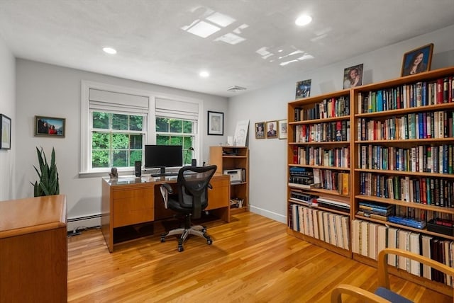 home office featuring light wood-style floors, recessed lighting, visible vents, and baseboard heating