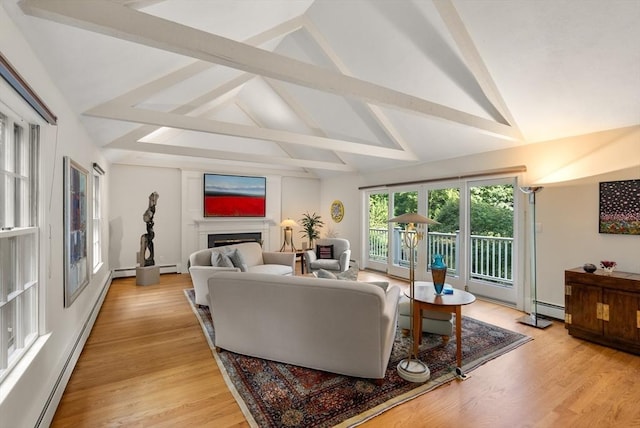 living room with vaulted ceiling with beams, light wood-style floors, a fireplace, and baseboard heating