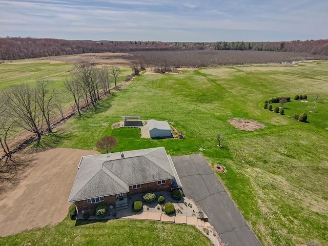 birds eye view of property with a rural view