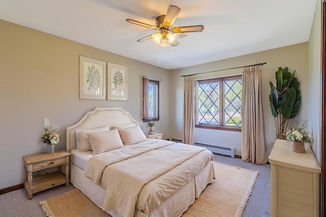 bedroom with a baseboard radiator, baseboards, a ceiling fan, and light carpet