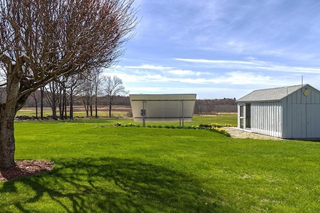 view of yard with an outbuilding and a storage shed