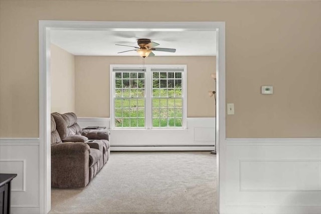 110 Northbridge Rd, Mendon, MA 01756 - living area with wainscoting, baseboard heating, a ceiling fan, and carpet flooring