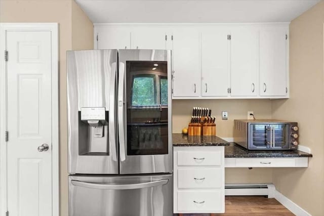 110 Northbridge Rd, Mendon, MA 01756 - kitchen featuring stainless steel refrigerator with ice dispenser, baseboard heating, white cabinets, dark stone counters, and baseboards