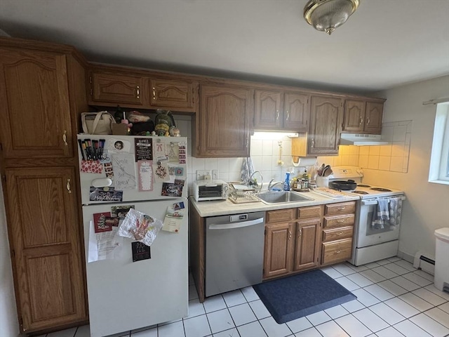 22 Bryon Rd Unit 3, Boston, MA 02467 - kitchen with white appliances, under cabinet range hood, light countertops, a sink, and baseboard heating