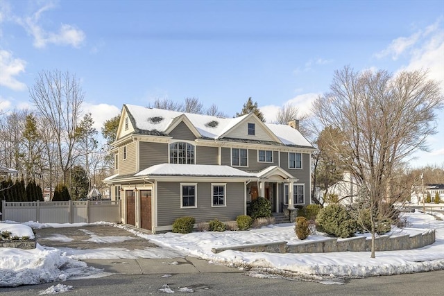 view of front of house featuring a chimney and fence