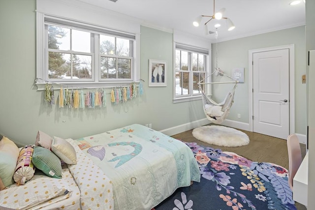 bedroom with crown molding, a notable chandelier, wood finished floors, and baseboards