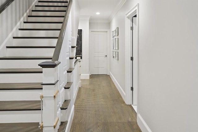 hallway with baseboards, stairway, ornamental molding, recessed lighting, and wood finished floors