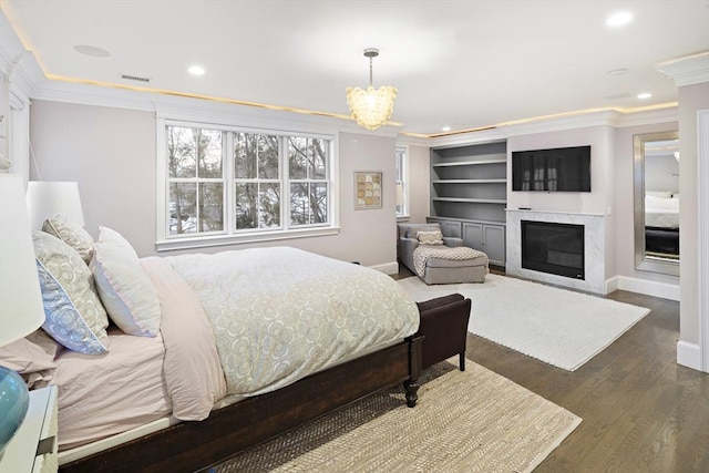 bedroom with visible vents, recessed lighting, crown molding, and wood finished floors