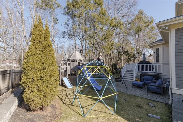 view of yard with a patio area, a playground, and fence