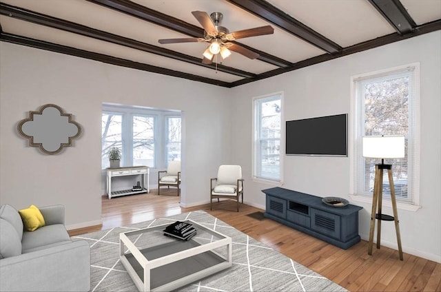 living room with baseboards and light wood-type flooring