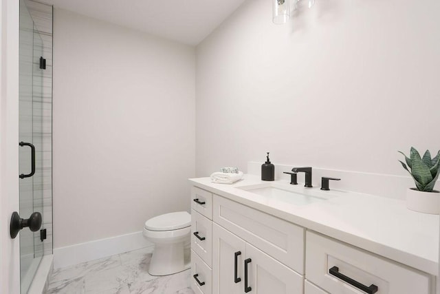 bathroom featuring vanity, an enclosed shower, and toilet