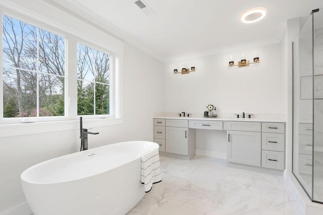 bathroom with vanity, a bath, and ornamental molding