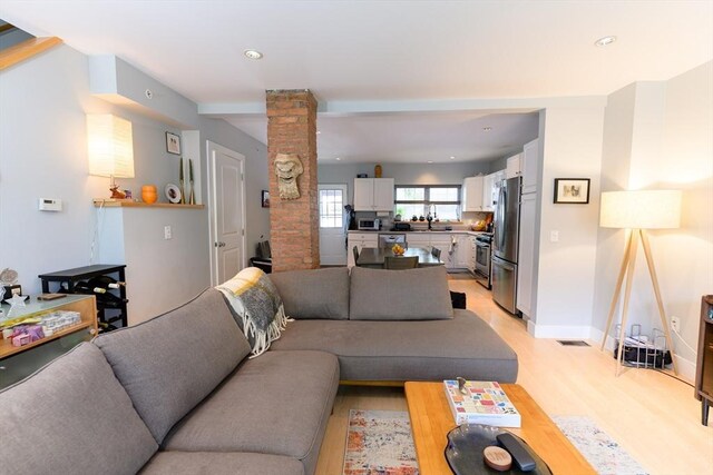 25 Taft St Unit 25, North Adams, MA 01247 - living room with ornate columns, light wood-style flooring, recessed lighting, and baseboards