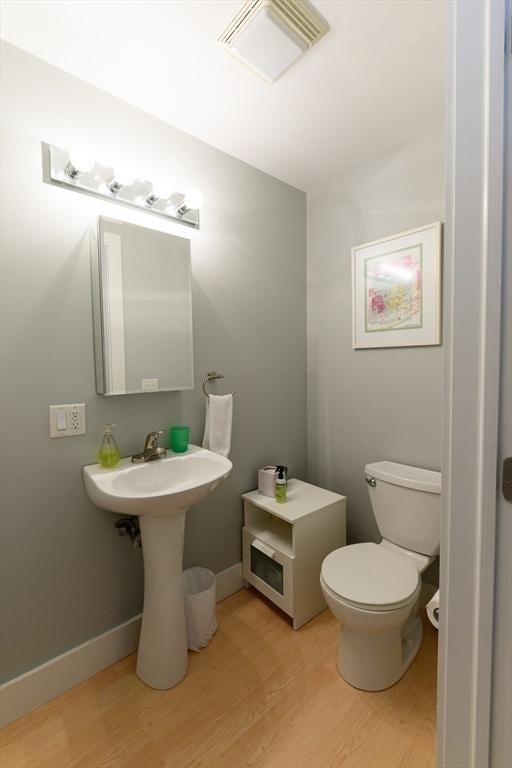 25 Taft St Unit 25, North Adams, MA 01247 - bathroom featuring wood finished floors and toilet
