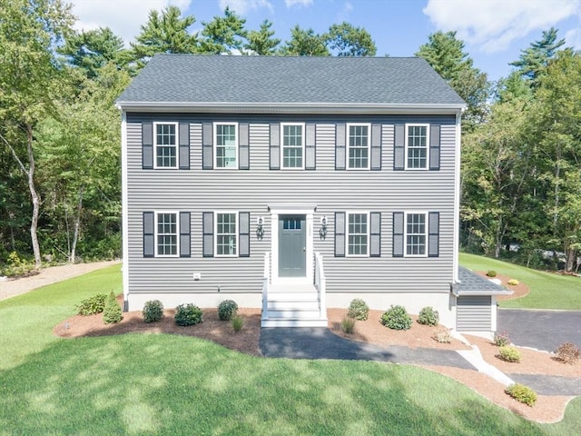 142 Tispaquin St, Middleboro, MA 02346 - colonial-style house with a front lawn and a shingled roof