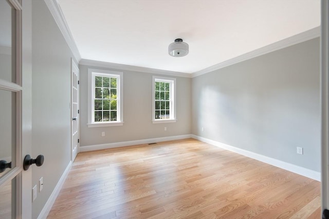 142 Tispaquin St, Middleboro, MA 02346 - unfurnished room featuring ornamental molding, light wood-style floors, and baseboards