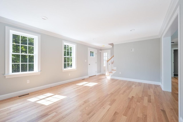 142 Tispaquin St, Middleboro, MA 02346 - unfurnished living room featuring crown molding, baseboards, light wood-style floors, and stairs