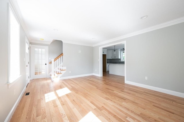 142 Tispaquin St, Middleboro, MA 02346 - unfurnished room featuring ornamental molding, light wood-style floors, stairs, and baseboards