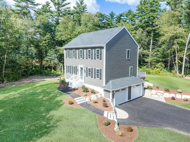 142 Tispaquin St, Middleboro, MA 02346 - view of front of house with roof with shingles, driveway, a front lawn, and an attached garage