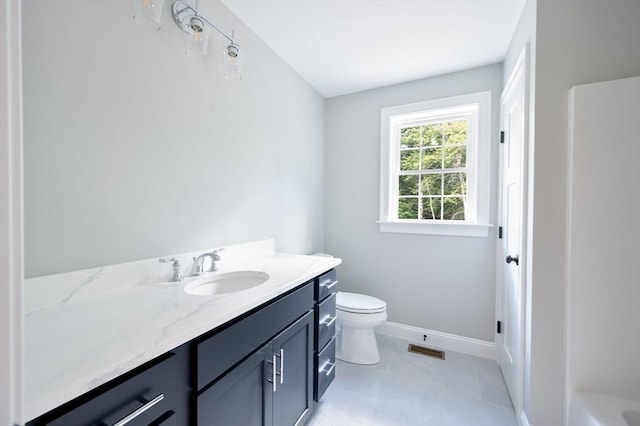 142 Tispaquin St, Middleboro, MA 02346 - bathroom featuring vanity, toilet, and baseboards