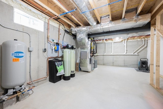 142 Tispaquin St, Middleboro, MA 02346 - below grade area with heating unit, a water pressure tank, and a water softener system