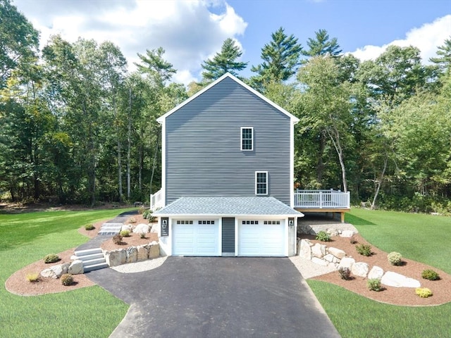 142 Tispaquin St, Middleboro, MA 02346 - view of side of home with driveway, a yard, an attached garage, and a wooden deck