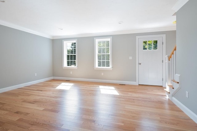 142 Tispaquin St, Middleboro, MA 02346 - entrance foyer featuring ornamental molding, stairway, light wood finished floors, and baseboards