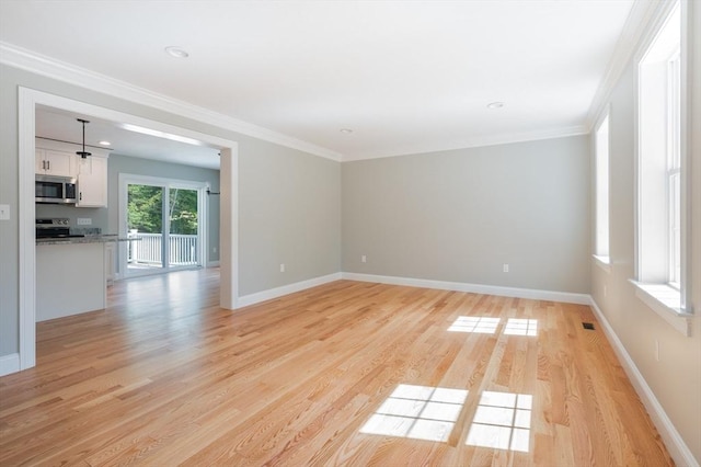 142 Tispaquin St, Middleboro, MA 02346 - unfurnished room featuring light wood-type flooring, baseboards, and crown molding