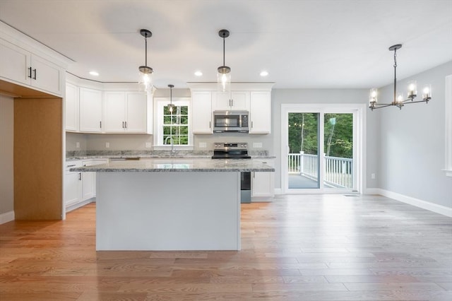 142 Tispaquin St, Middleboro, MA 02346 - kitchen with appliances with stainless steel finishes, a sink, baseboards, recessed lighting, and white cabinets