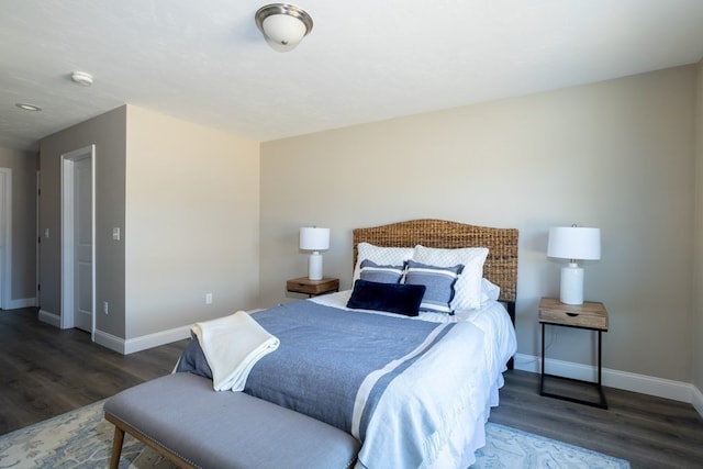 bedroom with dark hardwood / wood-style flooring