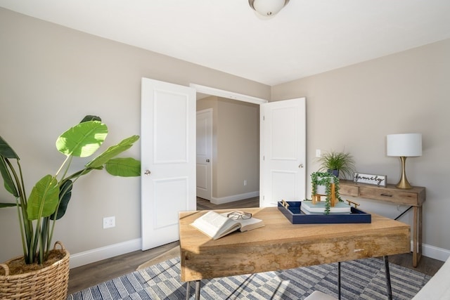 office with dark hardwood / wood-style floors