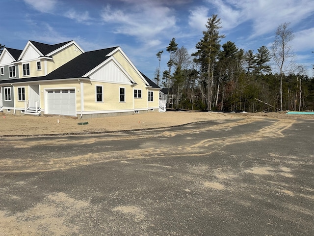 view of property exterior featuring a garage