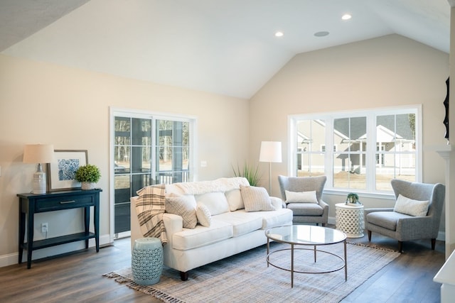 living room featuring vaulted ceiling and dark hardwood / wood-style flooring