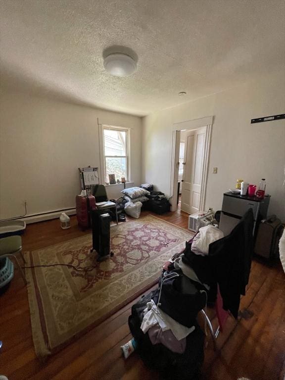 22 Florence St, Worcester, MA 01610 - living room with wood finished floors and a textured ceiling
