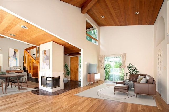 79 Myles View Dr, Duxbury, MA 02332 - living room featuring a wood ceiling with exposed beams, high vaulted ceiling, wood finished floors, and stairs