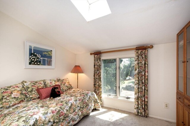 79 Myles View Dr, Duxbury, MA 02332 - carpeted bedroom with a skylight and vaulted ceiling