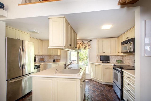 79 Myles View Dr, Duxbury, MA 02332 - kitchen featuring stainless steel appliances, cream cabinetry, backsplash, and light countertops