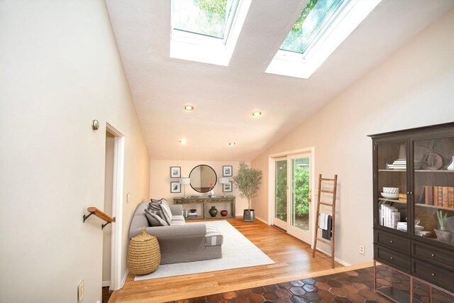 79 Myles View Dr, Duxbury, MA 02332 - living room with lofted ceiling, a skylight, and wood finished floors