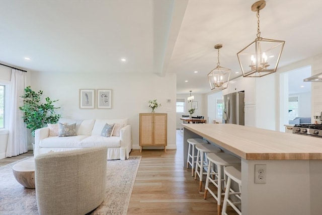 29 Regal St, Holliston, MA 01746 - living area with a chandelier, recessed lighting, and light wood-style flooring