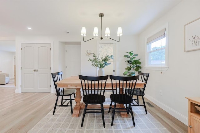 29 Regal St, Holliston, MA 01746 - dining room with light wood-style flooring, a chandelier, baseboards, and recessed lighting