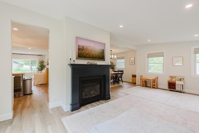 29 Regal St, Holliston, MA 01746 - living room featuring plenty of natural light, wine cooler, light wood finished floors, recessed lighting, and baseboards
